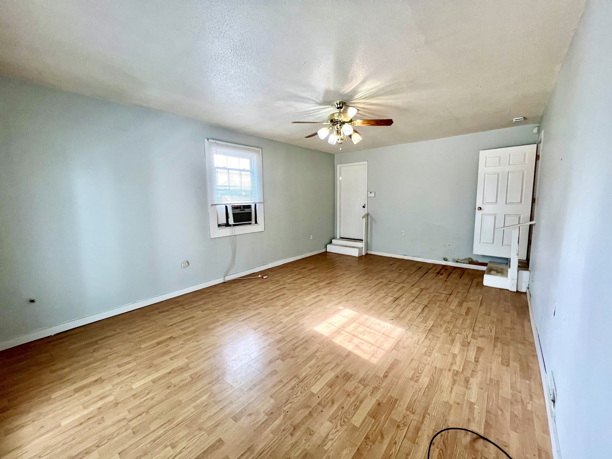 1100 Buffalo Road Lawrenceburg, TN 38464 - Photo 31 of 56 an empty room with wooden floor and windows