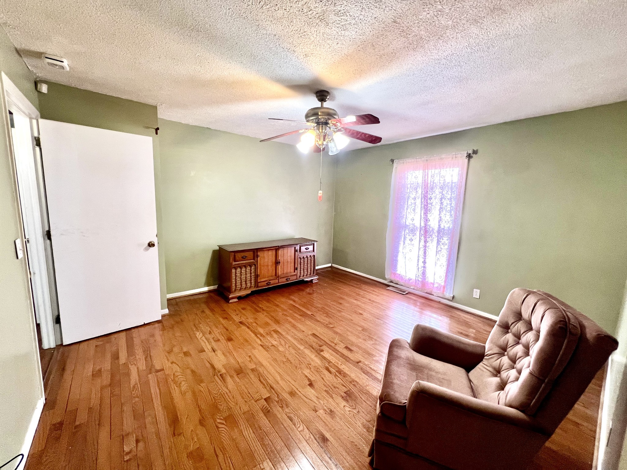 1100 Buffalo Road Lawrenceburg, TN 38464 - Photo 33 of 56 a living room with furniture and wooden floor