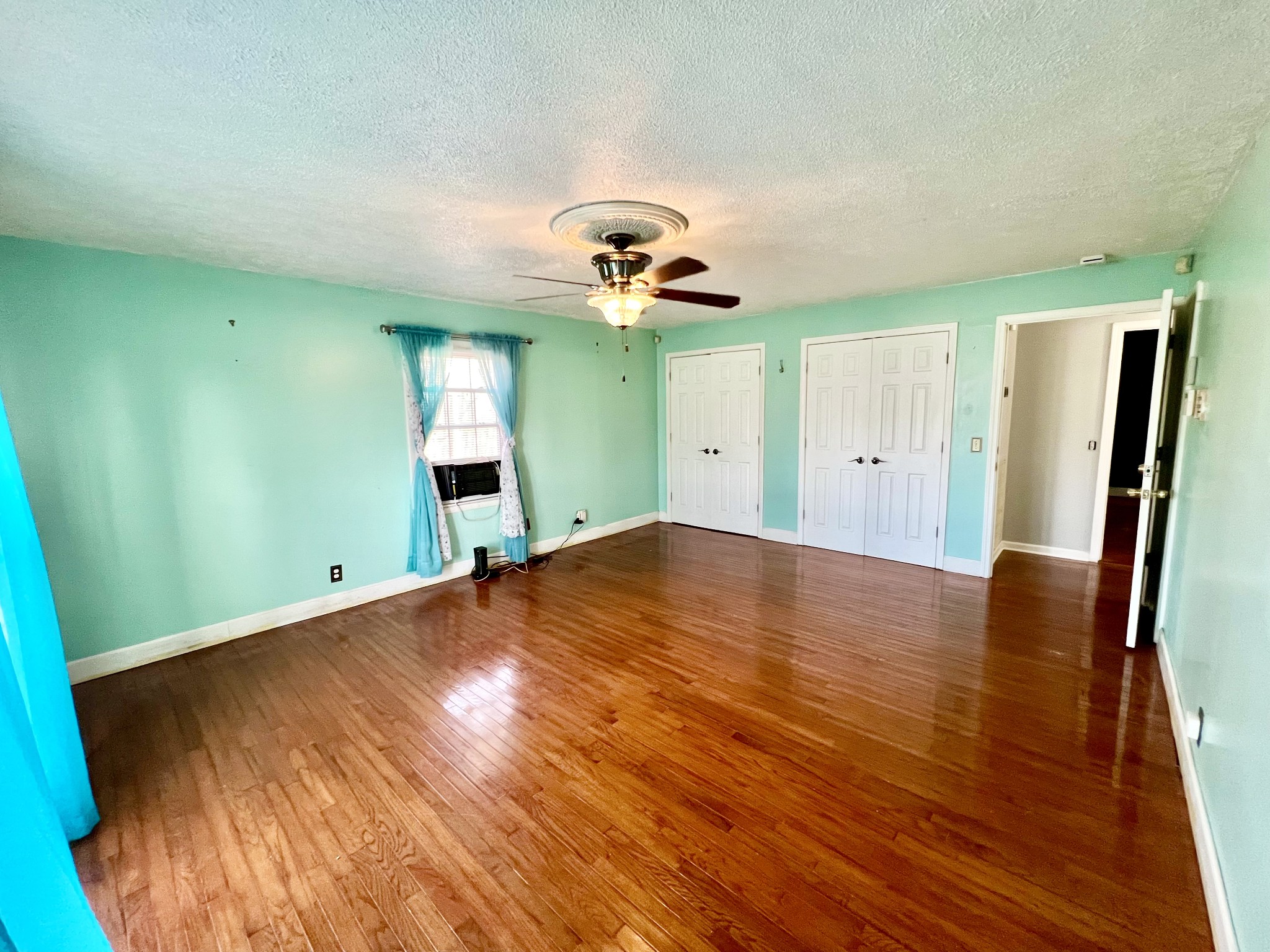 1100 Buffalo Road Lawrenceburg, TN 38464 - Photo 40 of 56 wooden floor in an empty room with a window