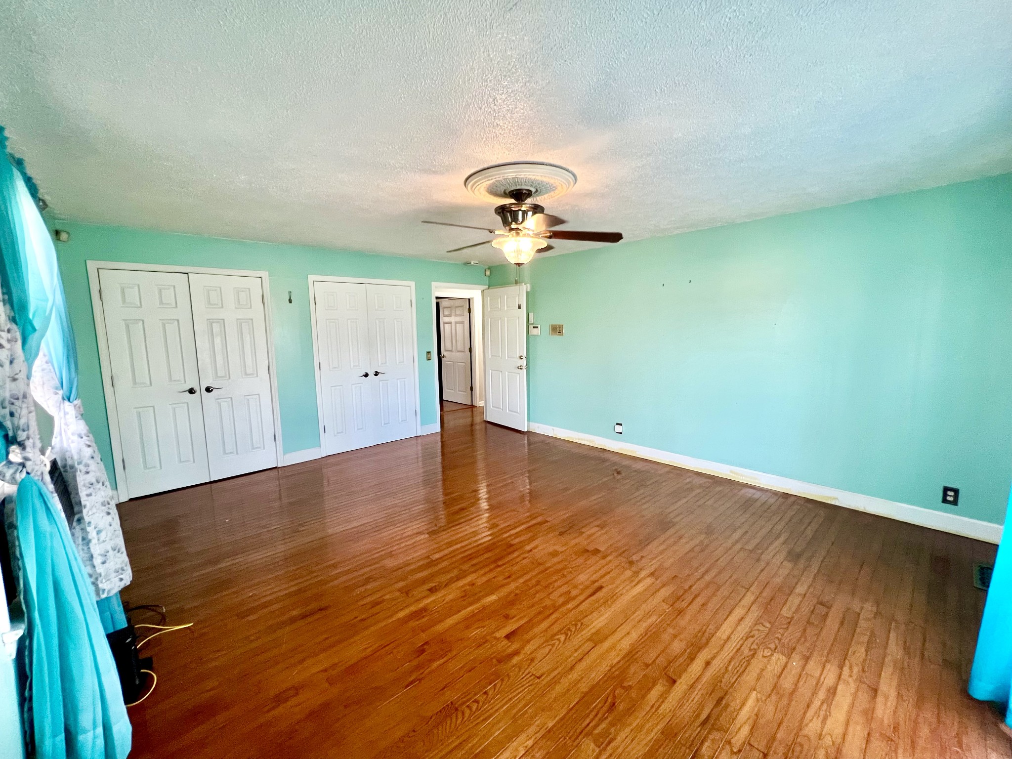 1100 Buffalo Road Lawrenceburg, TN 38464 - Photo 41 of 56 a view of a room with wooden floor and chandelier fan