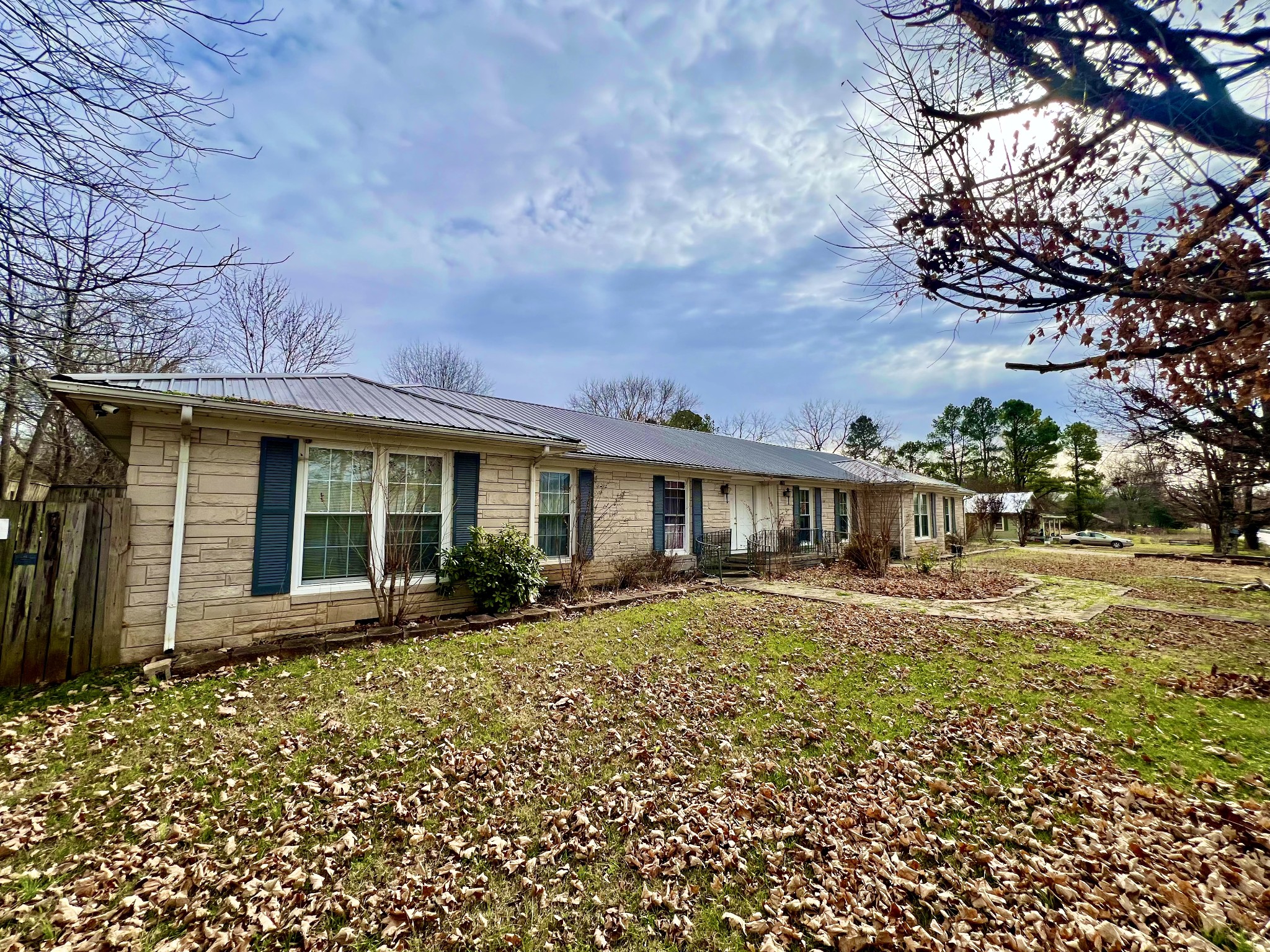 1100 Buffalo Road Lawrenceburg, TN 38464 - Photo 6 of 56 a front view of a house with a garden