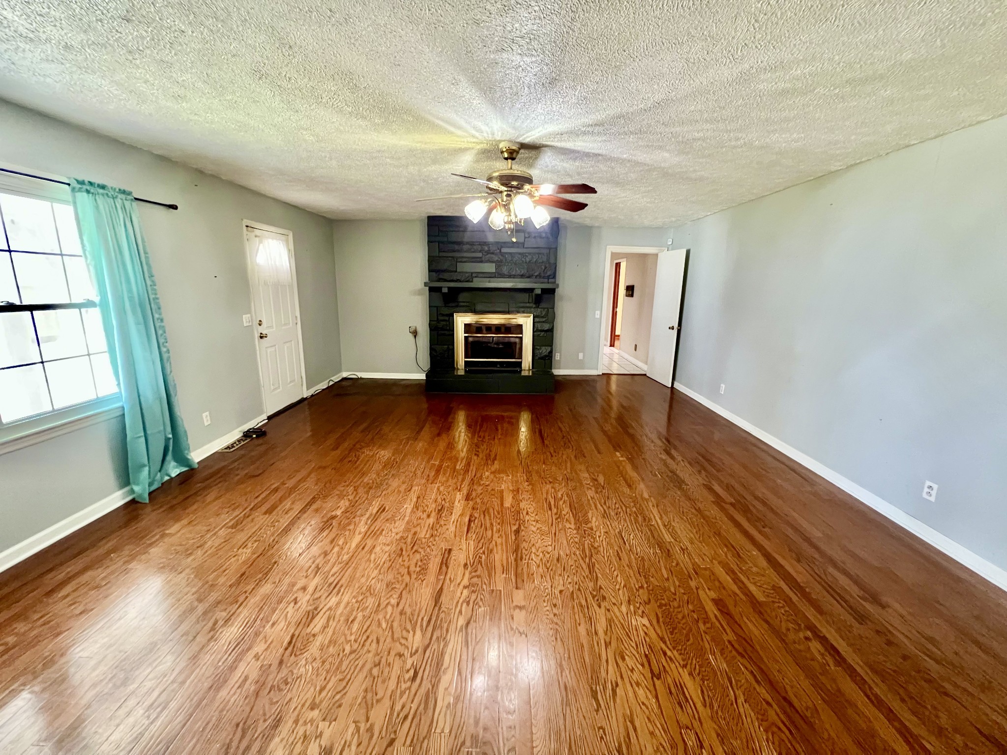1100 Buffalo Road Lawrenceburg, TN 38464 - Photo 10 of 56 wooden floor in an empty room with a window