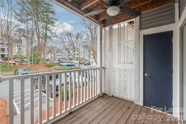 a view of a porch with wooden floor