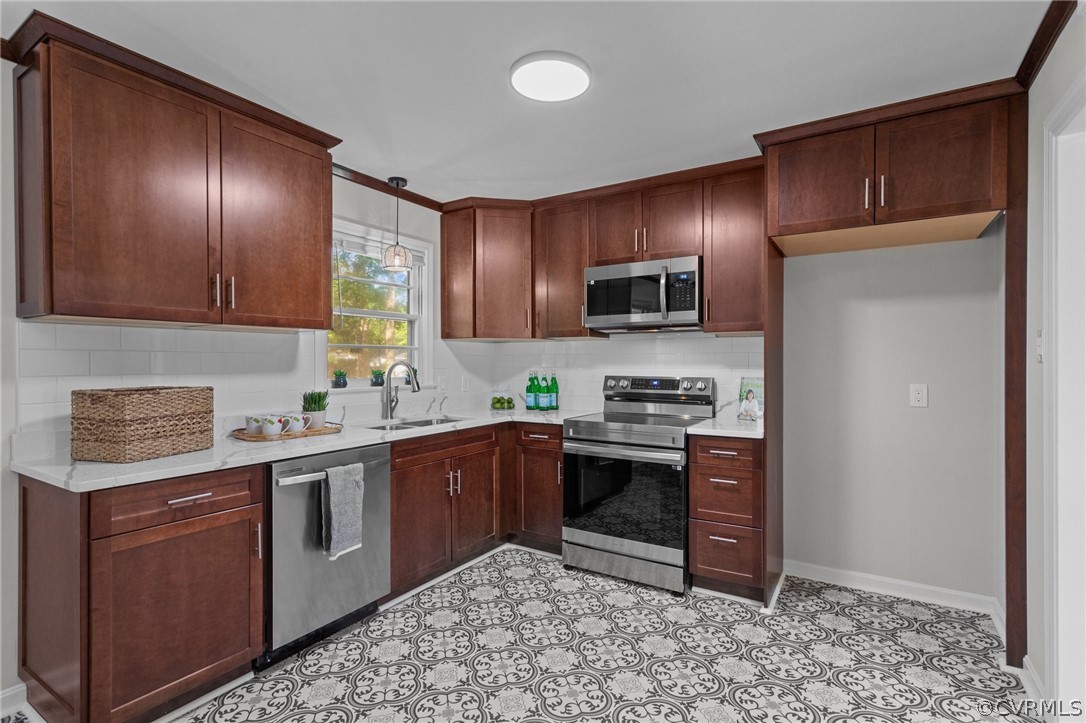 3910 Turner Road Chesterfield, VA 23832 - Photo 11 of 37 a kitchen with stainless steel appliances granite countertop wooden cabinets a stove a sink and a refrigerator