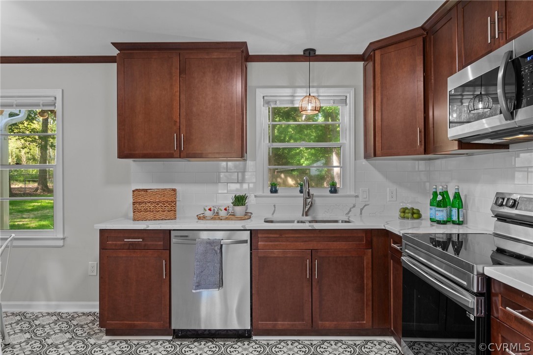 3910 Turner Road Chesterfield, VA 23832 - Photo 12 of 37 a kitchen with stainless steel appliances granite countertop a sink stove and cabinets
