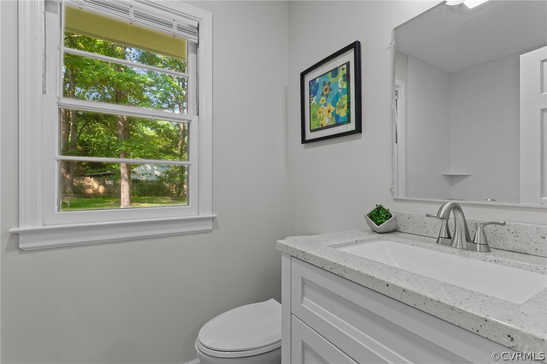 3910 Turner Road Chesterfield, VA 23832 - Photo 25 of 37 a bathroom with a granite countertop sink toilet and a window