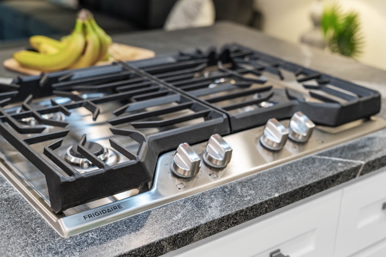 3138 Sunbeam Street Houston, TX 77051 - Photo 24 of 50 Cook like a chef with a premium gas range set atop bold 3CM granite countertops designed to elevate every culinary experience.