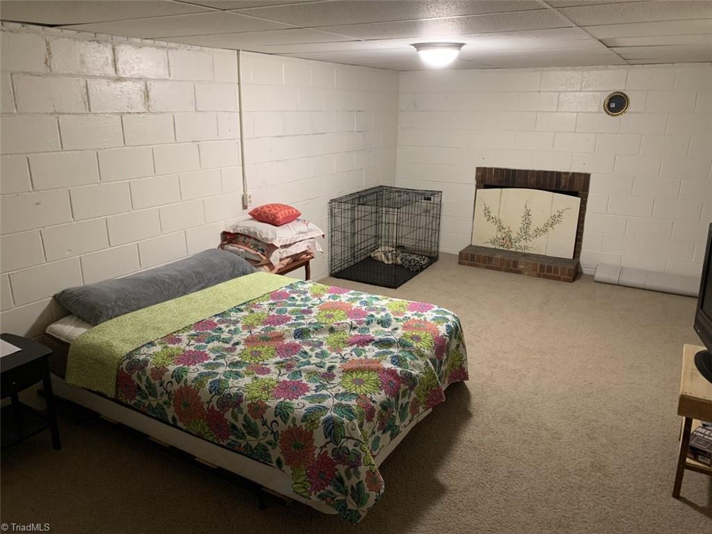 3795 Quaker Church Road Pinnacle, NC 27043 - Photo 14 of 19 Basement bedroom *no heat*