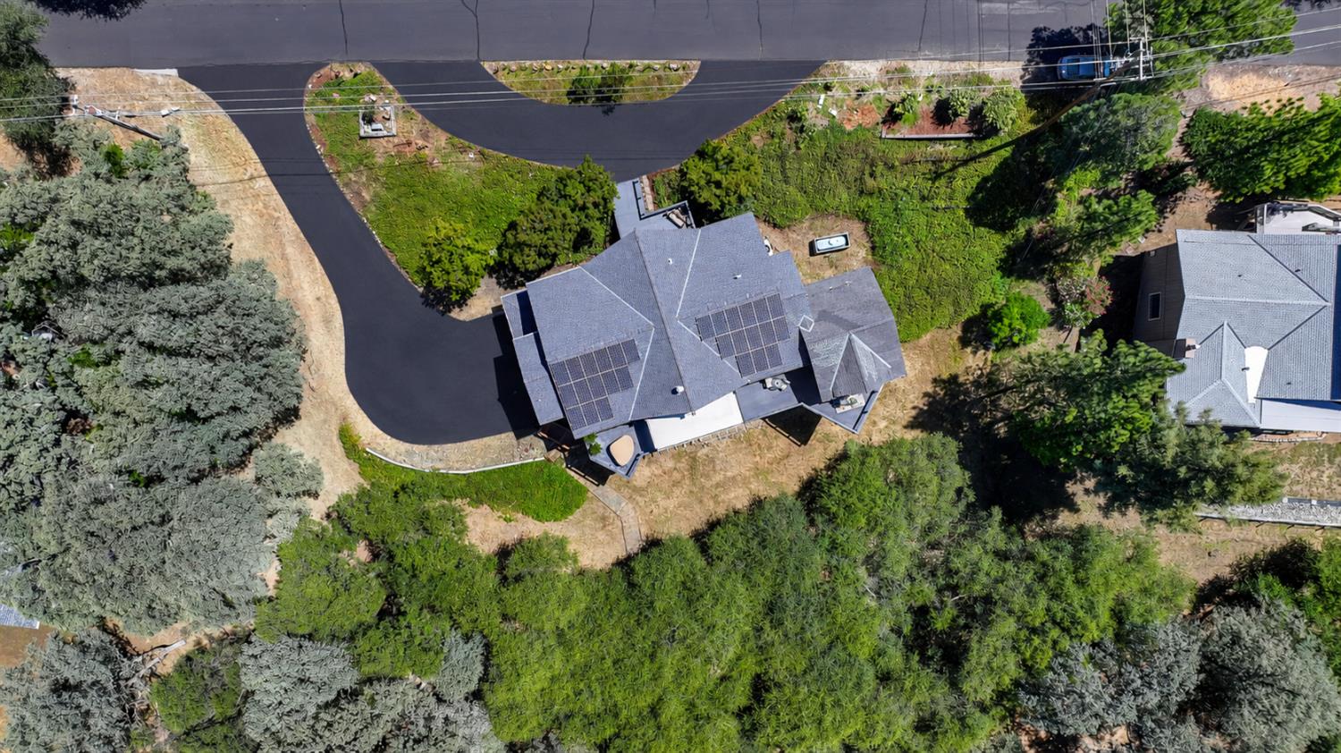 12253 Wanderer Road Auburn, CA 95602 - Photo 4 of 80 Driveway in the process of re-seal. This is what it should look like when complete.