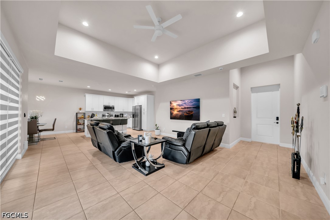 384 Neighborly Road LaBelle, FL 33935 - Photo 11 of 45 a living room with furniture and a flat screen tv