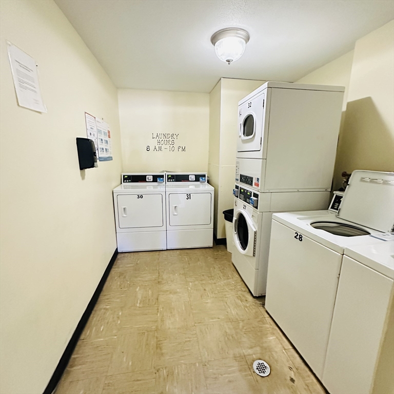 8 Shadowbrook Lane, Unit 38 Milford, MA 01757 - Photo 16 of 16 a utility room with dryer and washer