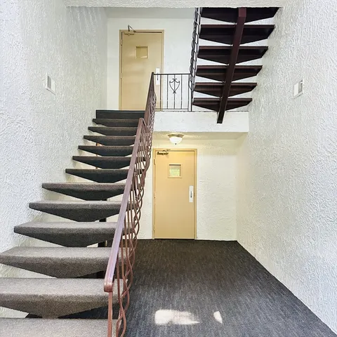 a view of entryway with wooden floor