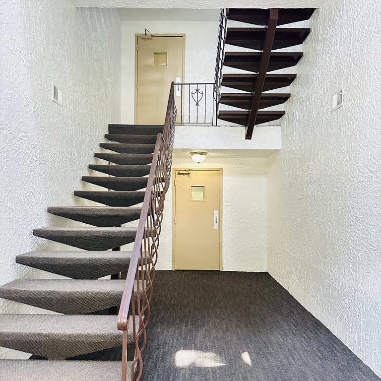 8 Shadowbrook Lane, Unit 38 Milford, MA 01757 - Photo 3 of 16 a view of entryway with wooden floor