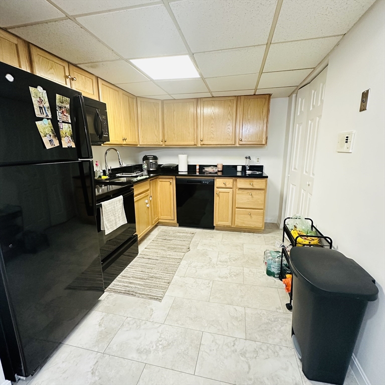 8 Shadowbrook Lane, Unit 38 Milford, MA 01757 - Photo 4 of 16 a kitchen with stainless steel appliances granite countertop a stove and a refrigerator