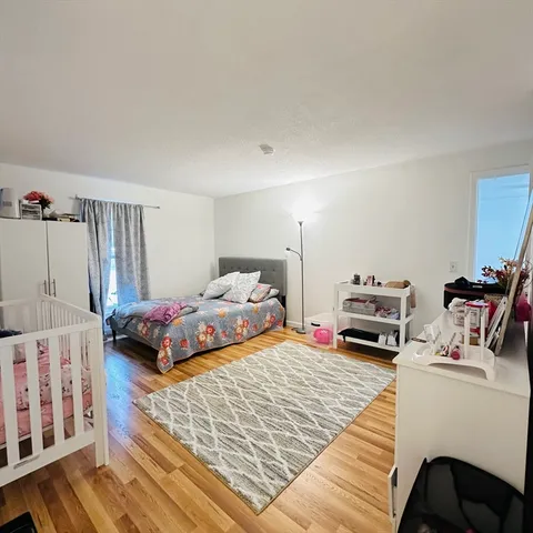a bedroom with furniture and a white bed