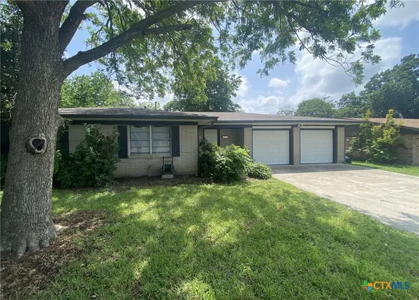 front view of house with a yard