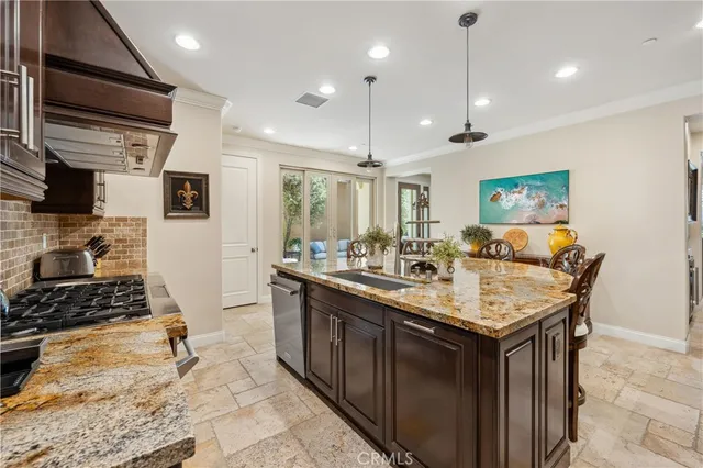 a bathroom with a sink vanity granite toilet and a mirror