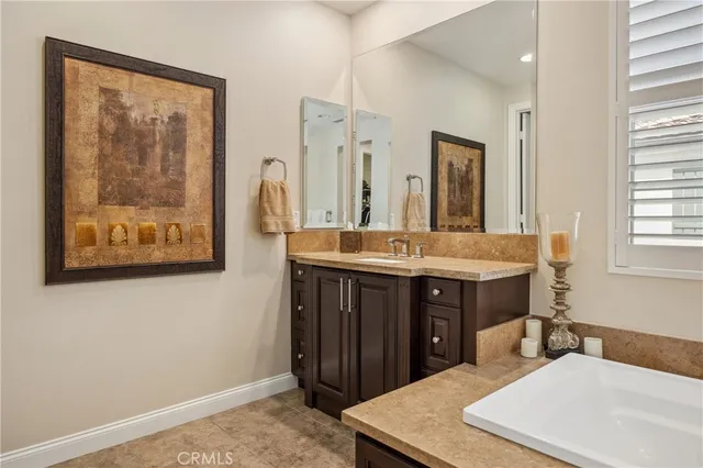 a view of walk in closet with clothes