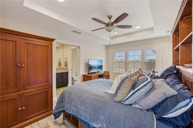 a living room filled with furniture and a floor to ceiling window