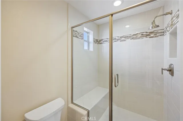 a view of a chair and tables in the patio