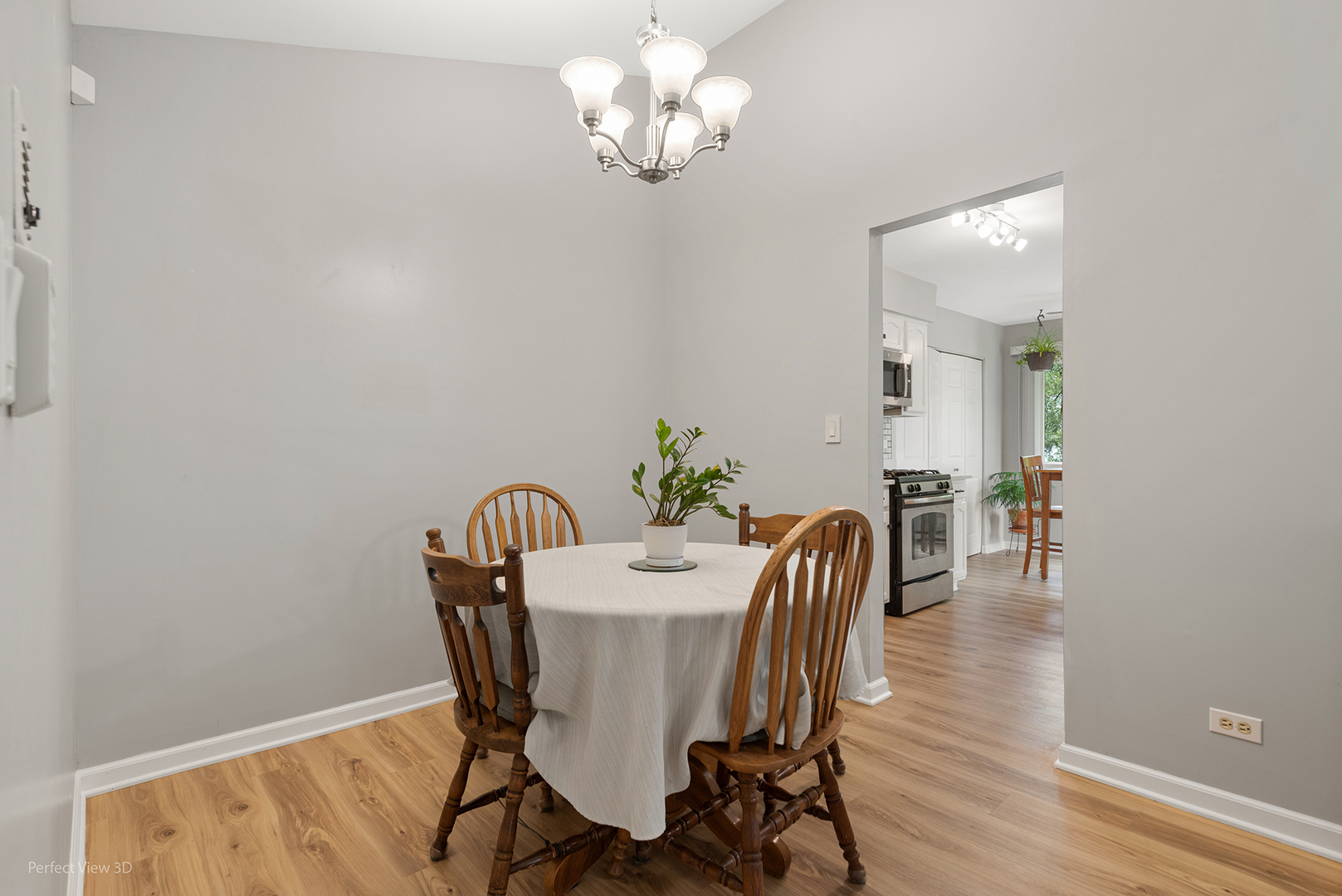 -n120 Windermere Road, Unit 2008 Winfield, IL 60190 - Photo 6 of 23 a view of a dining room with furniture and wooden floor