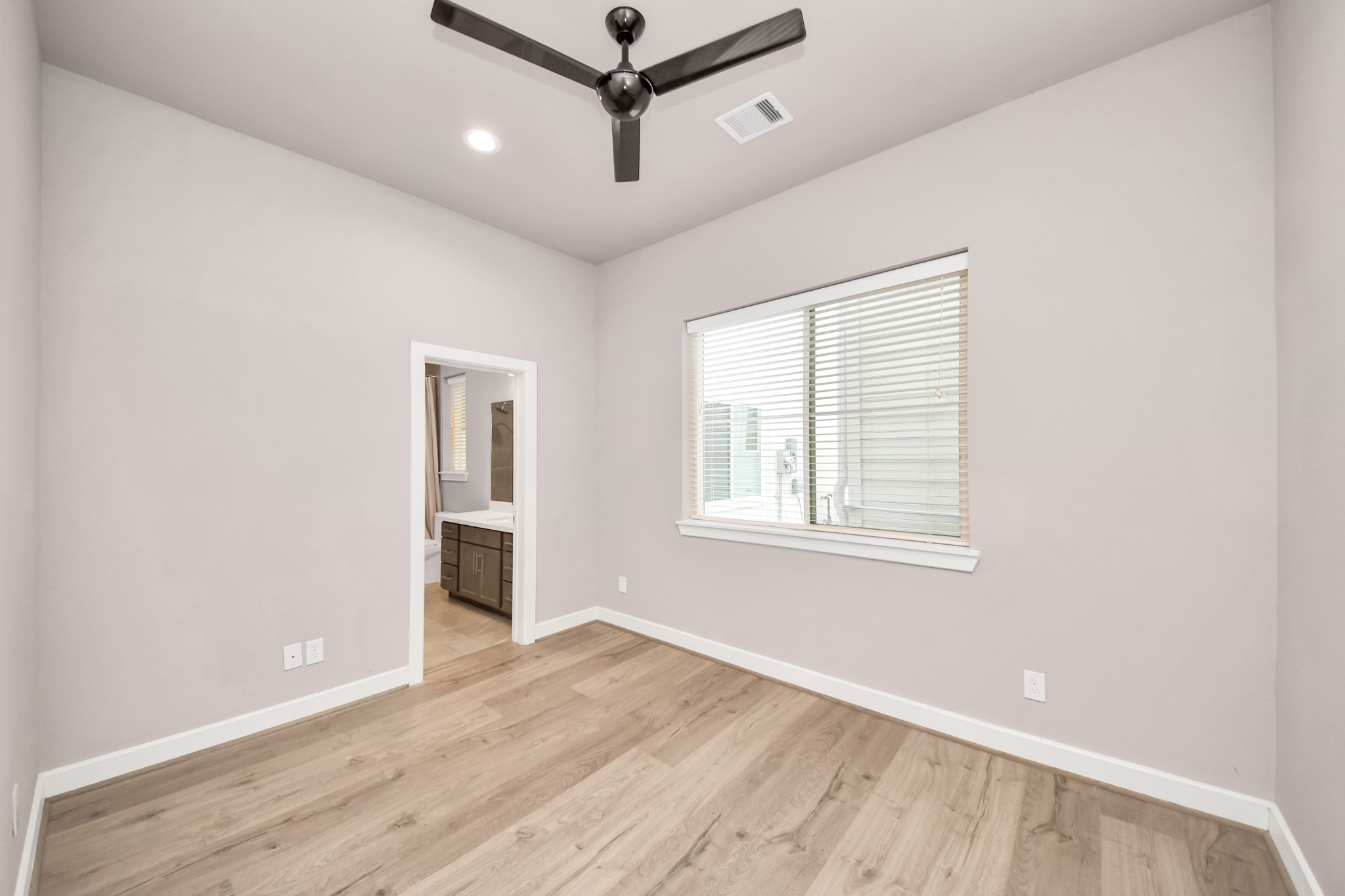2114 Stuart Street Houston, TX 77004 - Photo 35 of 39 wooden floor in an empty room with a window