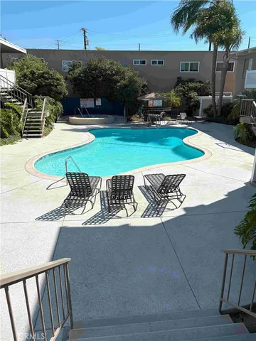 a view of a swimming pool with a patio