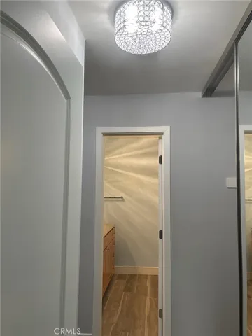 a view of a hallway with a window