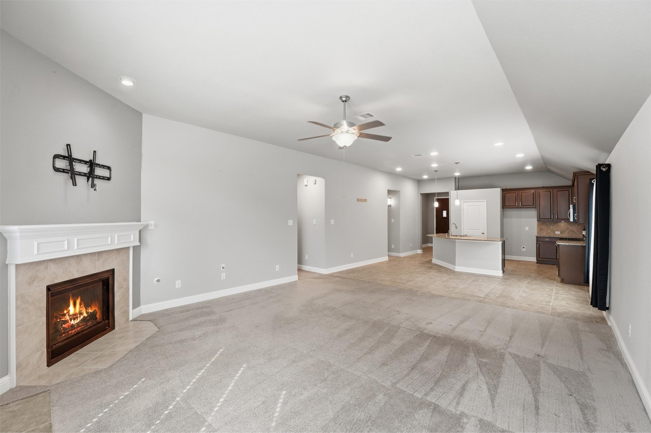1911 Cedar Ridge Lane Pearland, TX 77089 - Photo 17 of 33 Spacious living room with gas log fireplace and high ceilings - *fireplace virtually lit*