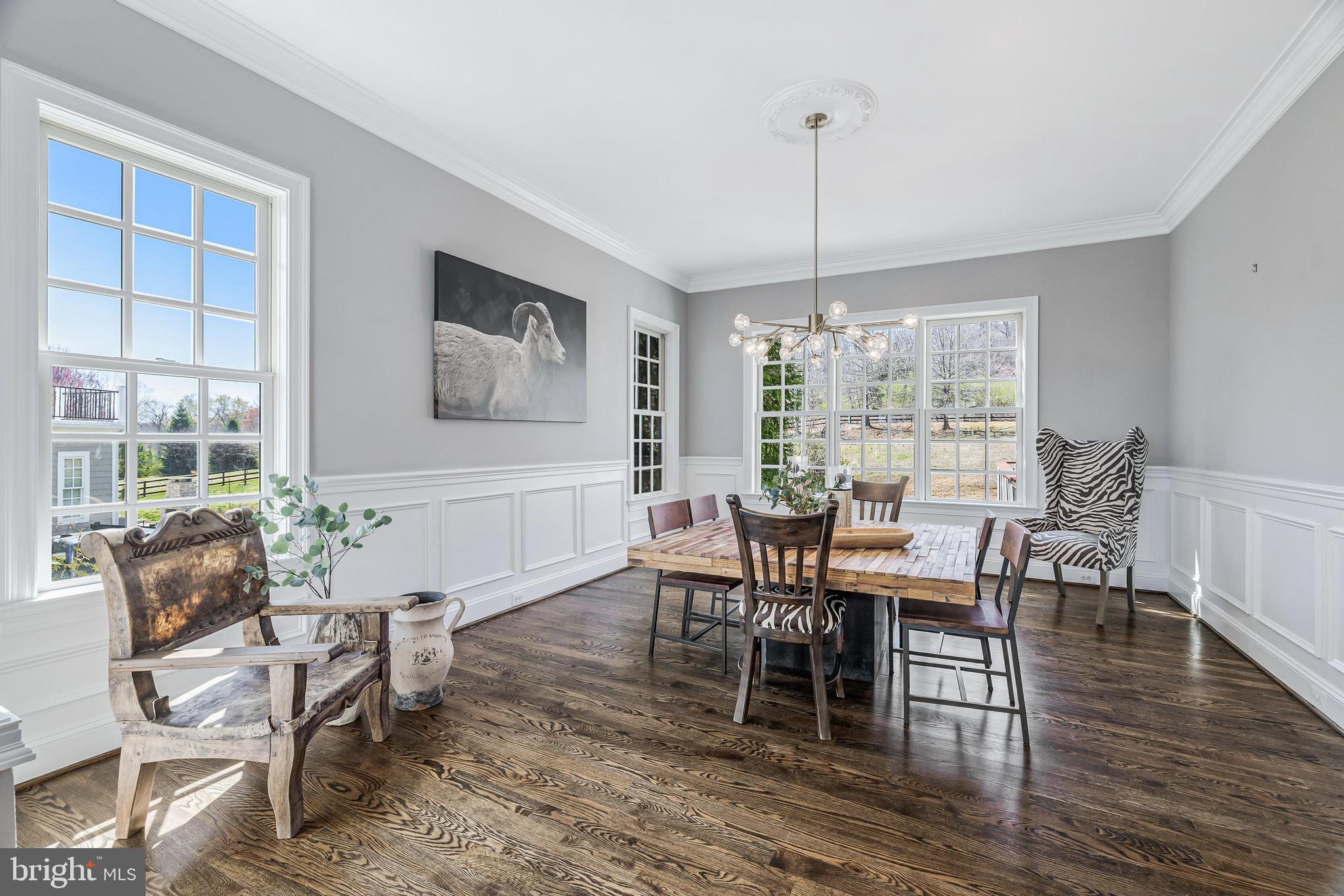 16319 Hunter Place Leesburg, VA 20176 - Photo 13 of 71 a dining room with furniture window wooden floor