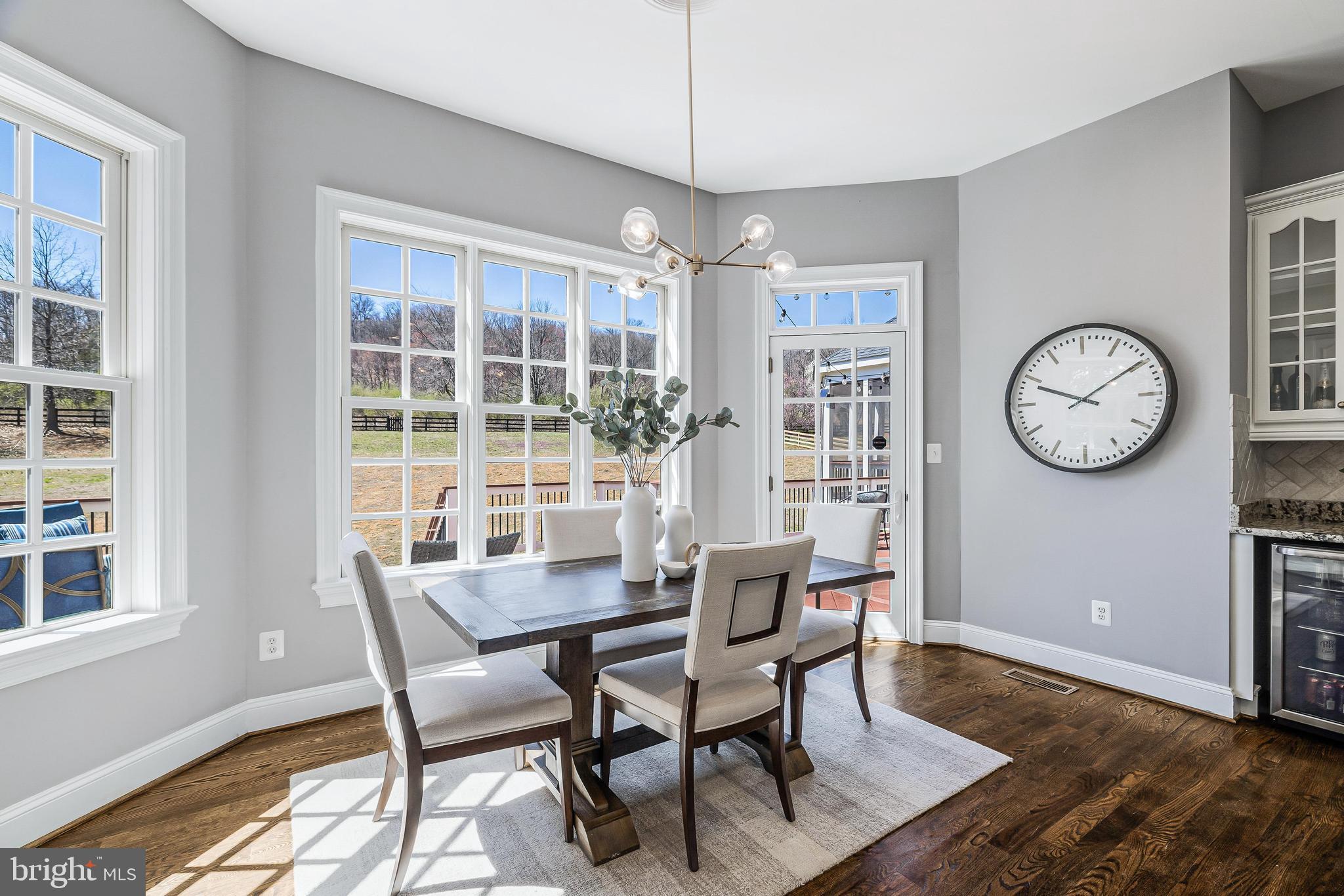 16319 Hunter Place Leesburg, VA 20176 - Photo 17 of 71 a view of a dining room with furniture window and wooden floor