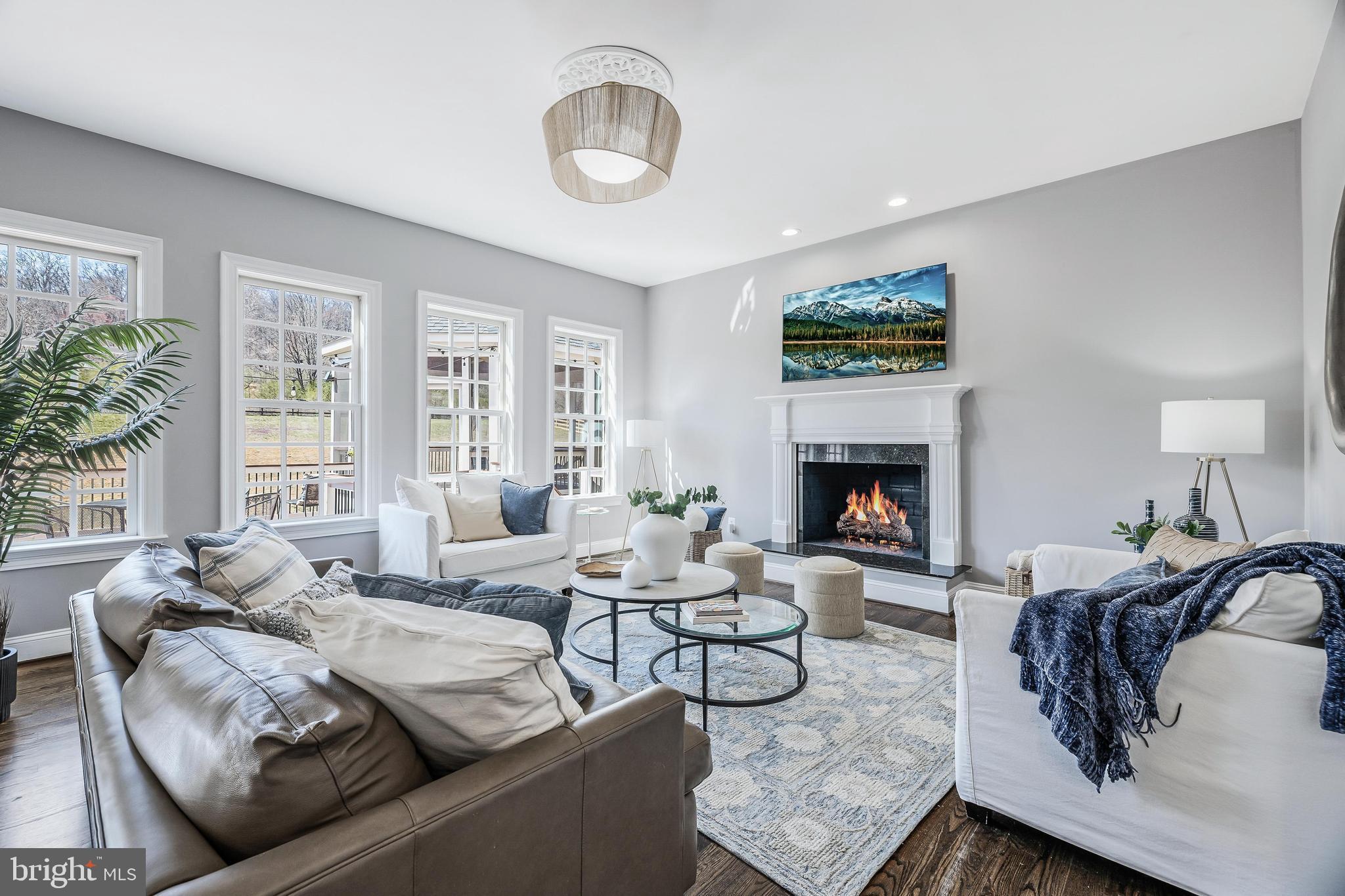 16319 Hunter Place Leesburg, VA 20176 - Photo 22 of 71 a living room with furniture and a fireplace