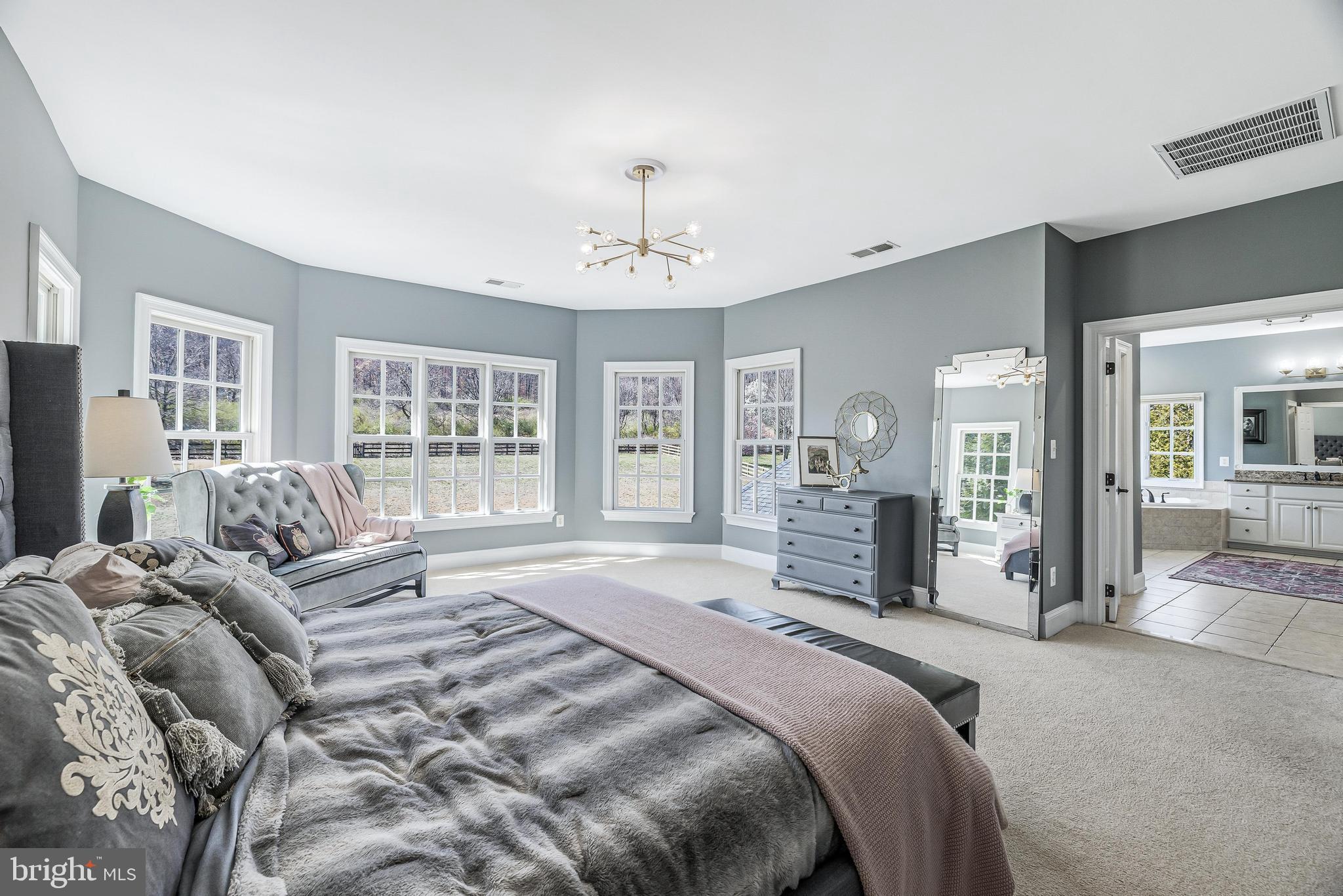 16319 Hunter Place Leesburg, VA 20176 - Photo 30 of 71 a spacious bedroom with a large bed and a large window