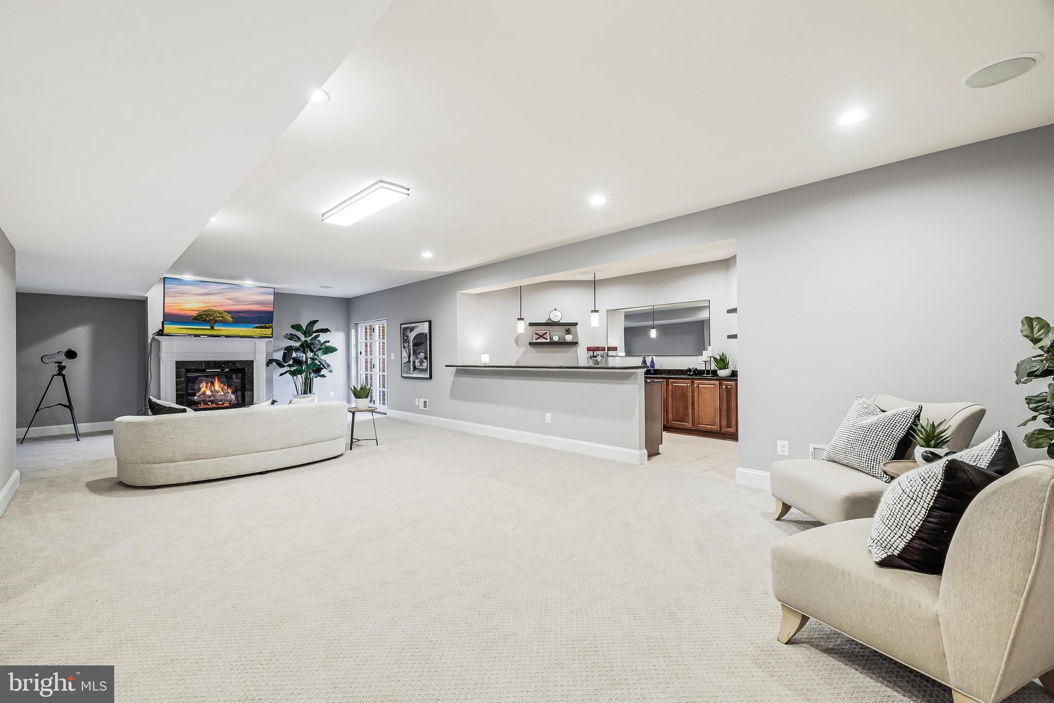 16319 Hunter Place Leesburg, VA 20176 - Photo 46 of 71 a living room with furniture and a kitchen area