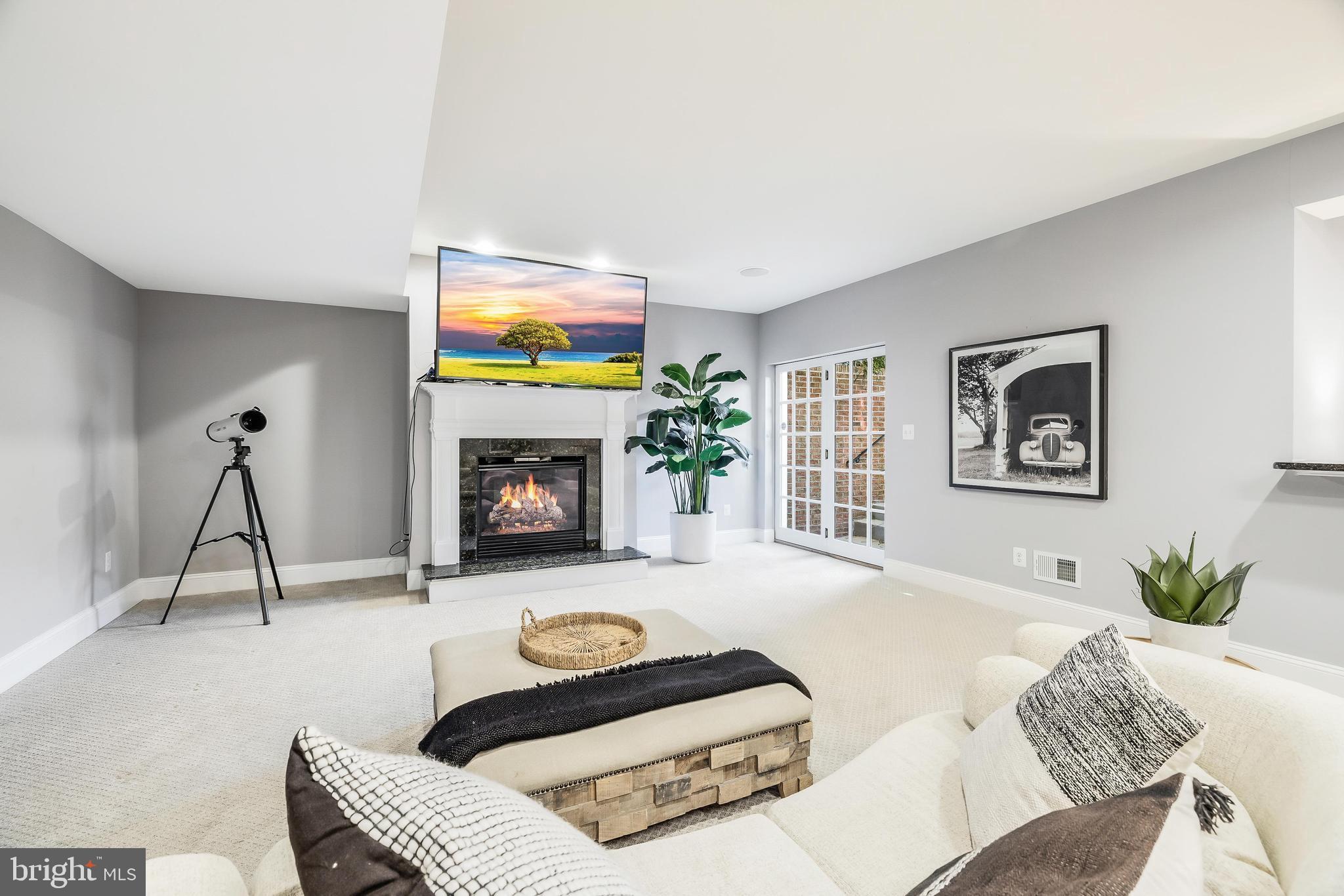 16319 Hunter Place Leesburg, VA 20176 - Photo 48 of 71 a living room with furniture and a fireplace