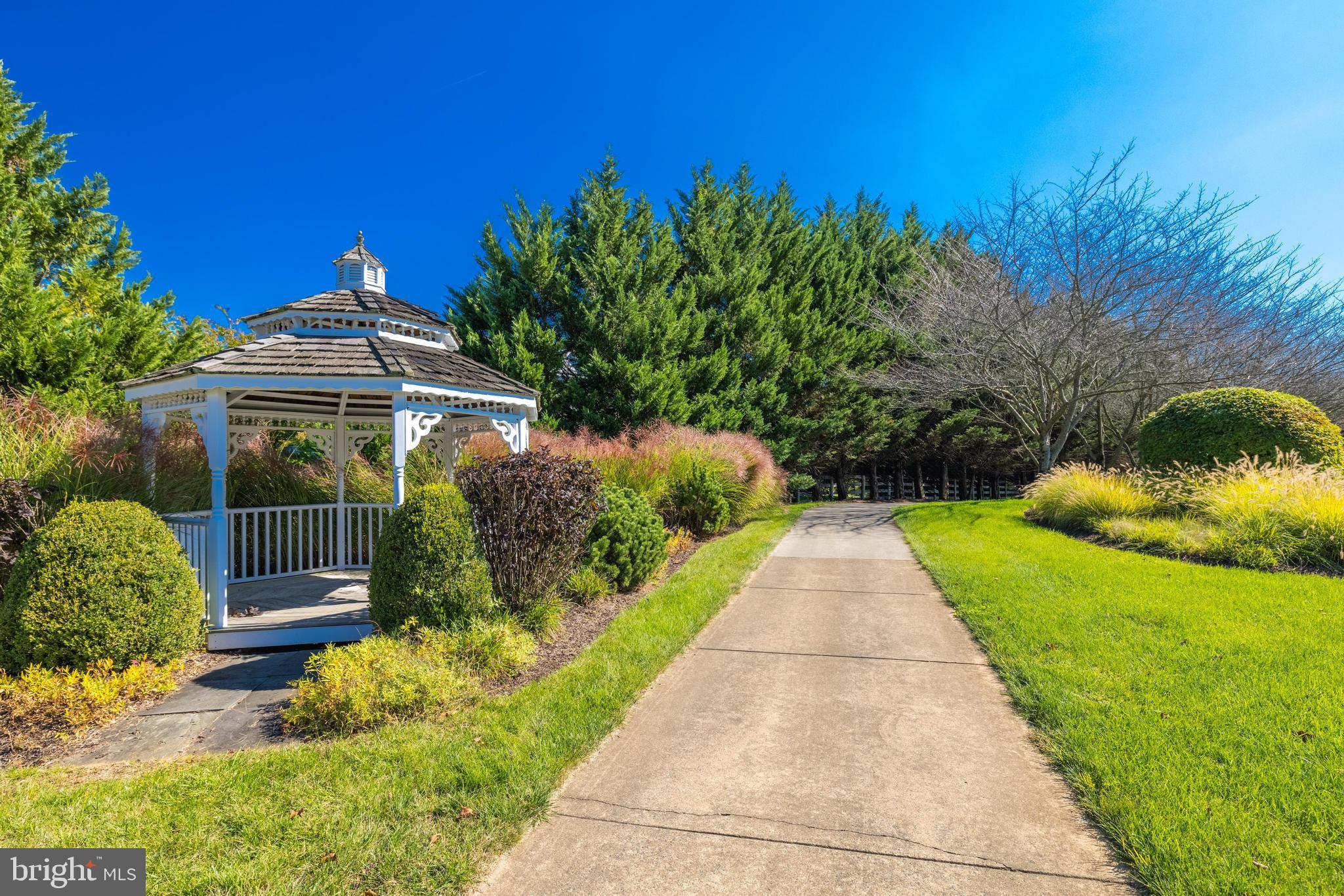 16319 Hunter Place Leesburg, VA 20176 - Photo 58 of 71 a view of a pathway both side of the house