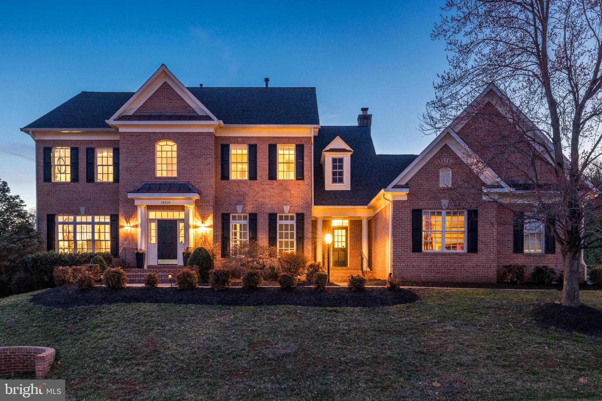 16319 Hunter Place Leesburg, VA 20176 - Photo 68 of 71 a front view of a house with a yard