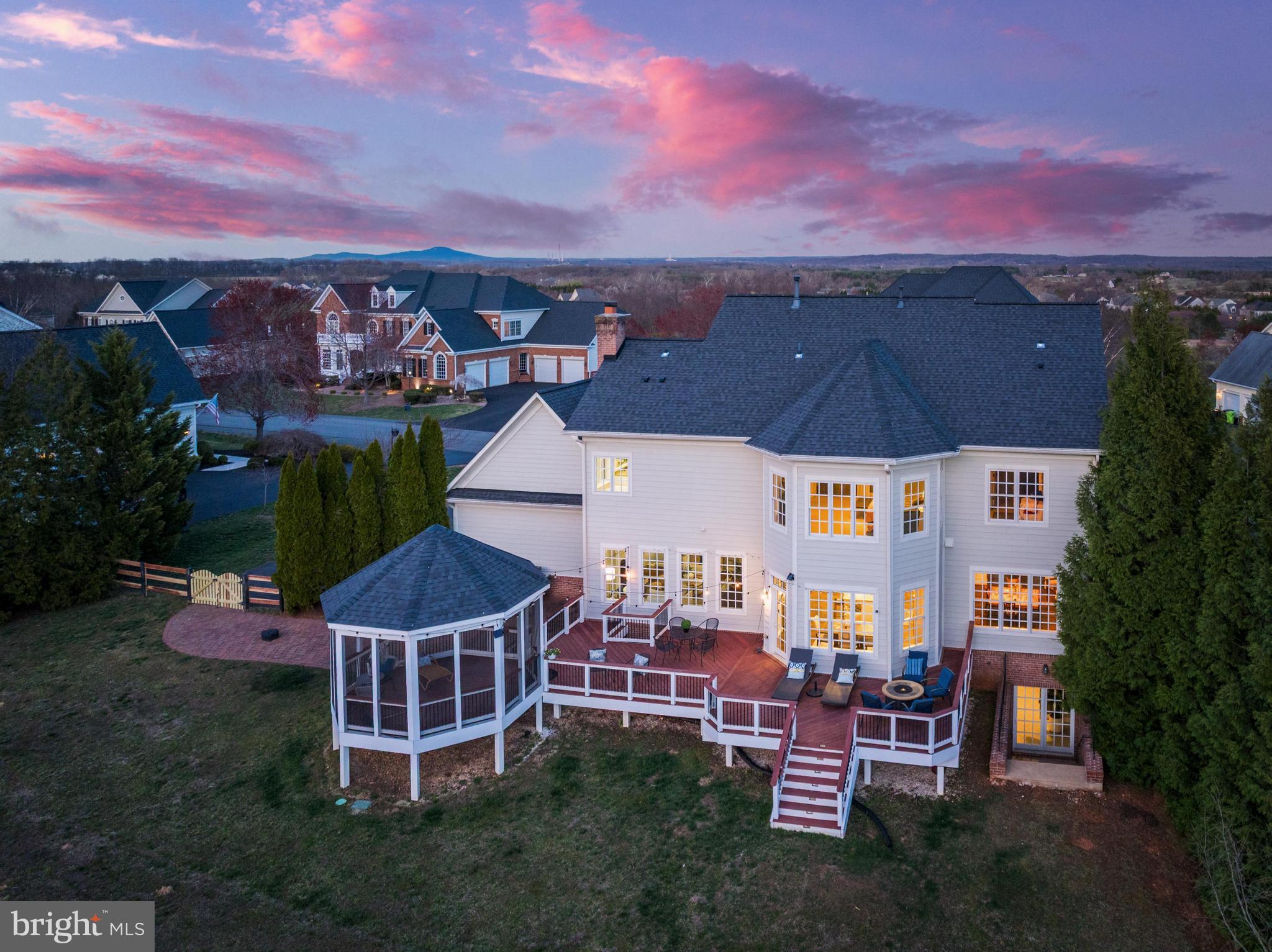 16319 Hunter Place Leesburg, VA 20176 - Photo 69 of 71 an aerial view of multiple house houses with a yard and outdoor seating
