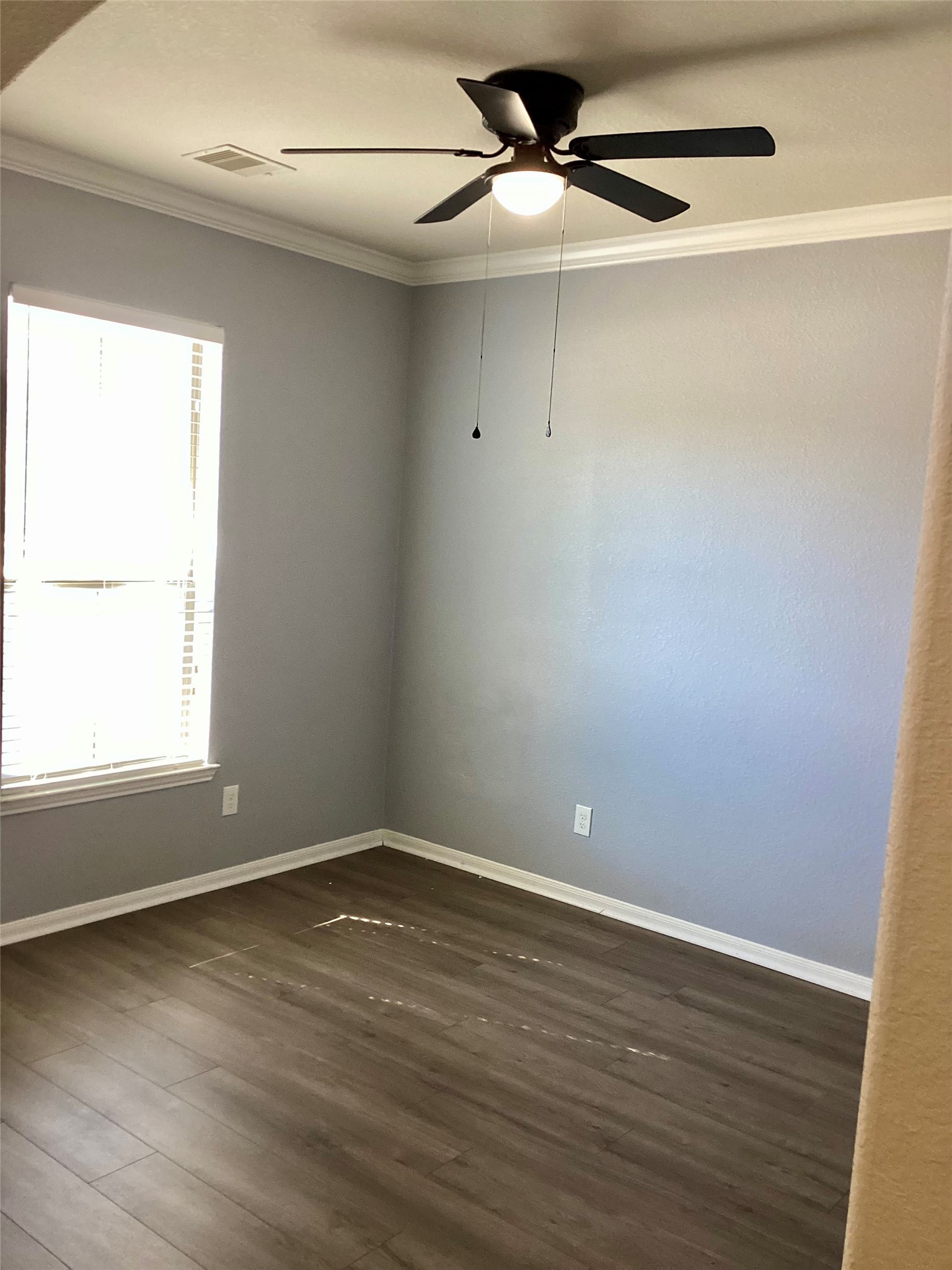 20122 Graphite Canyon Court Richmond, TX 77407 - Photo 13 of 27 This office features elegant wood flooring, ample natural light, and a modern ceiling fan, creating an ideal workspace.