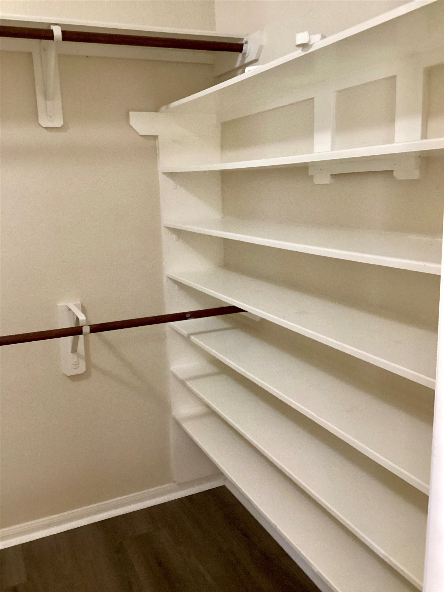 20122 Graphite Canyon Court Richmond, TX 77407 - Photo 15 of 27 Experience luxury in the main bedroom's spacious walk-in closet, complete with built-in shoe shelving for perfect organization.