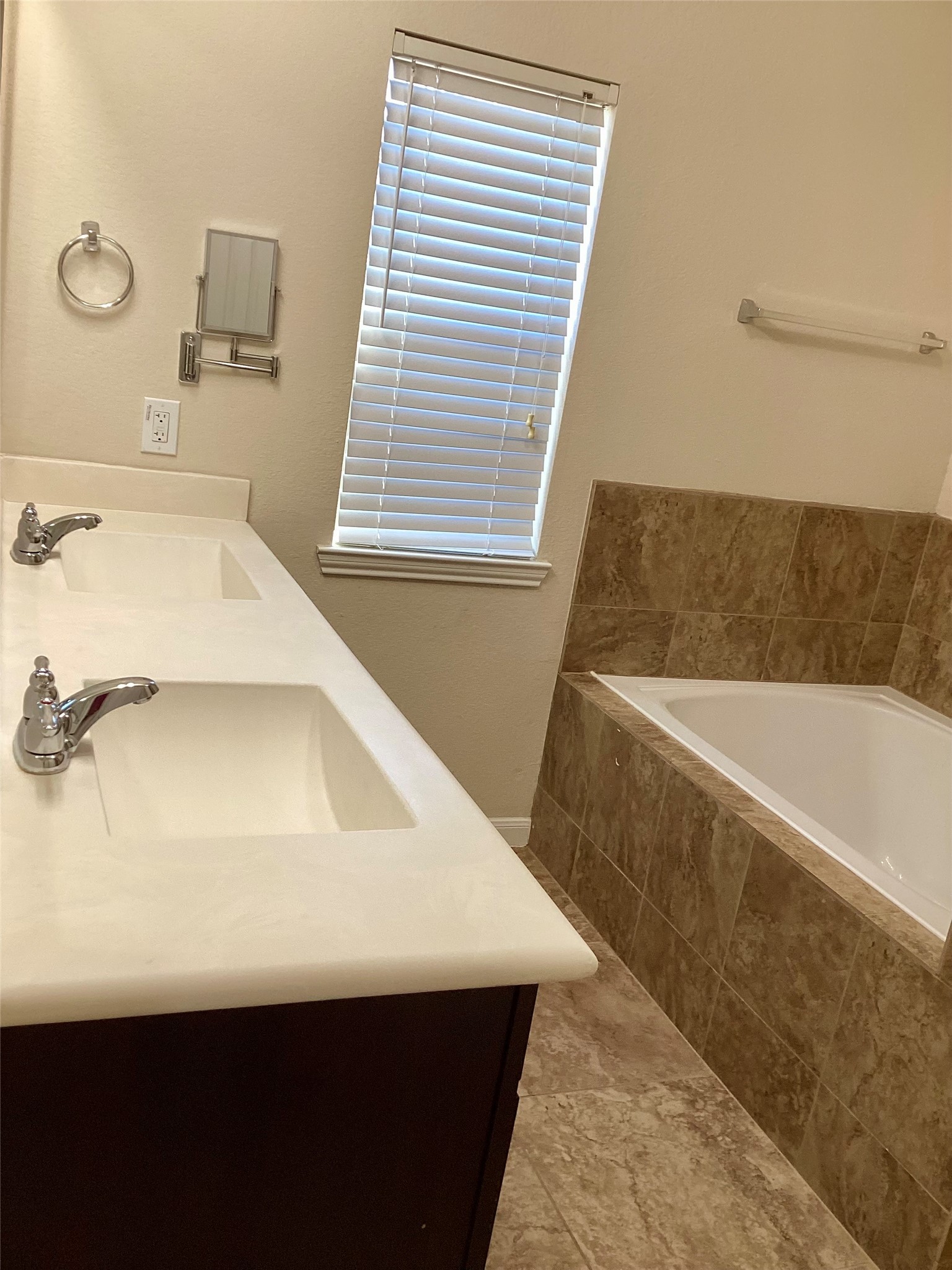 20122 Graphite Canyon Court Richmond, TX 77407 - Photo 16 of 27 Indulge in tranquility with this main bathroom’s luxurious tub, separate shower, and elegant double vanity.