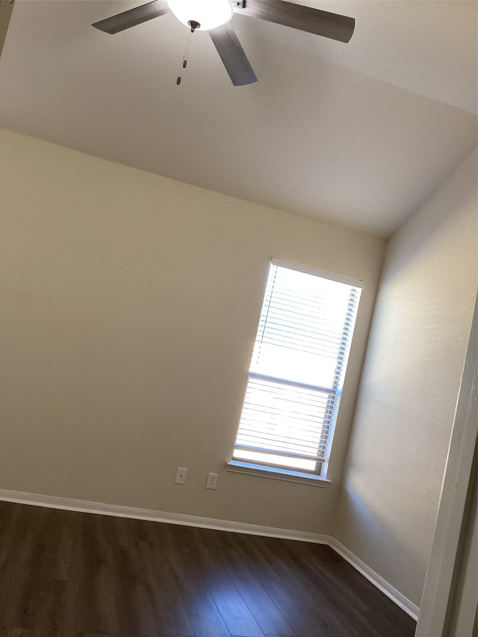 20122 Graphite Canyon Court Richmond, TX 77407 - Photo 20 of 27 Bright, cozy room with light walls, wooden floors, a window for natural light, and a ceiling fan for comfort.