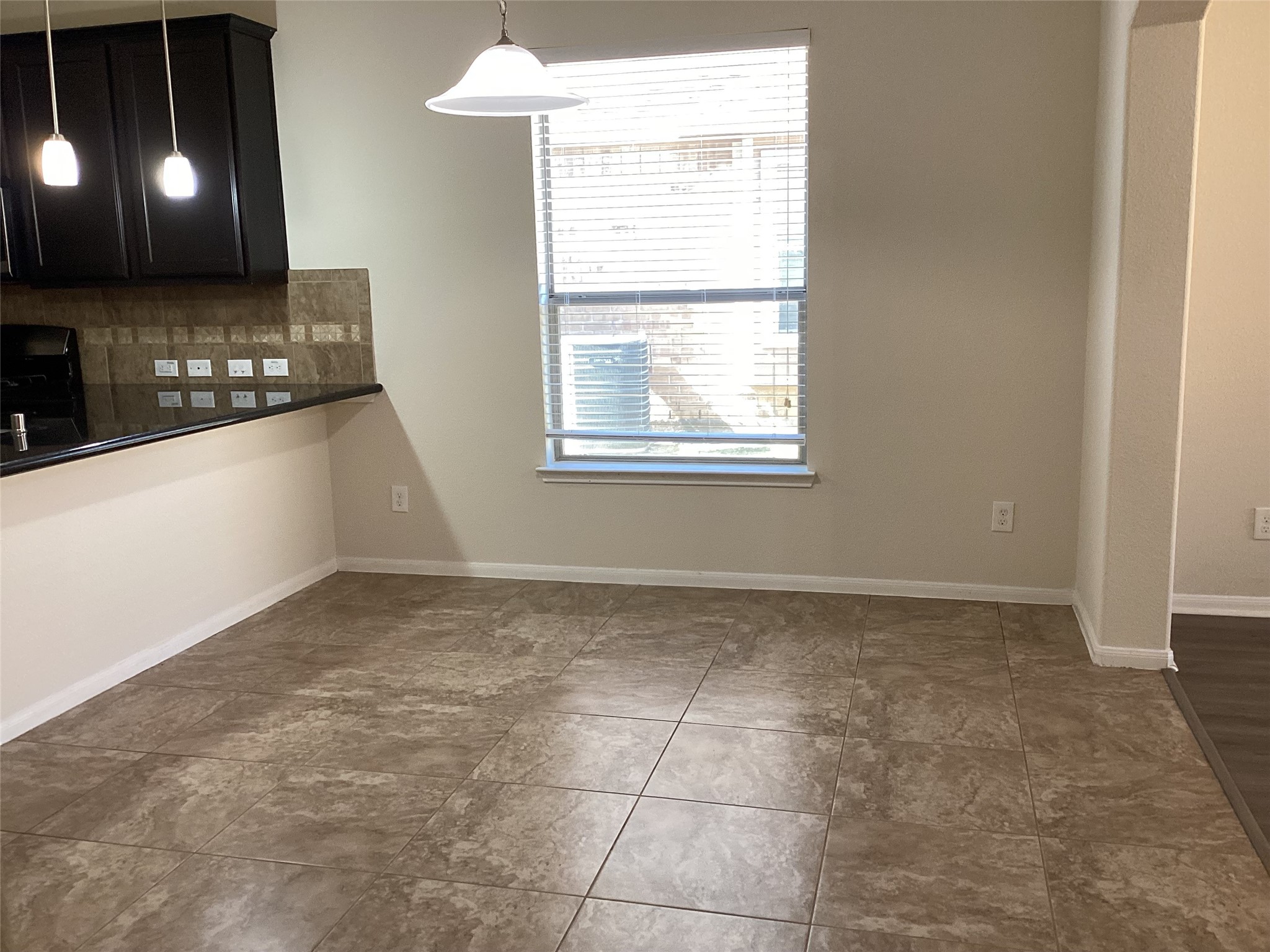20122 Graphite Canyon Court Richmond, TX 77407 - Photo 23 of 27 This elegant dining room boasts tile flooring, abundant natural light, and direct kitchen access—ideal for hosting unforgettable family dinners.