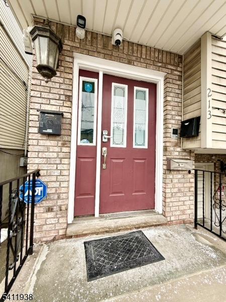 213 Palmer Street, Unit 2 Elizabeth, NJ 07202 - Photo 1 of 28 a front view of a house with many windows