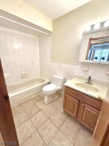 213 Palmer Street, Unit 2 Elizabeth, NJ 07202 - Photo 13 of 28 a bathroom with a granite countertop sink toilet and shower