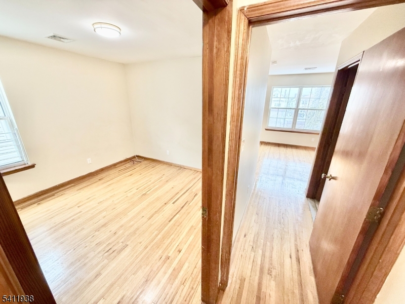 213 Palmer Street, Unit 2 Elizabeth, NJ 07202 - Photo 18 of 28 a view of an empty room and window