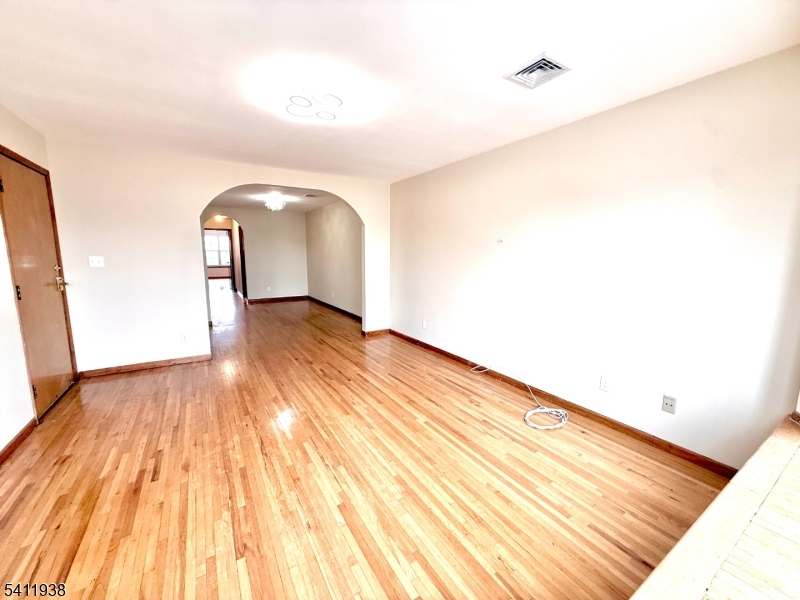 213 Palmer Street, Unit 2 Elizabeth, NJ 07202 - Photo 5 of 28 a view of a room with wooden floor