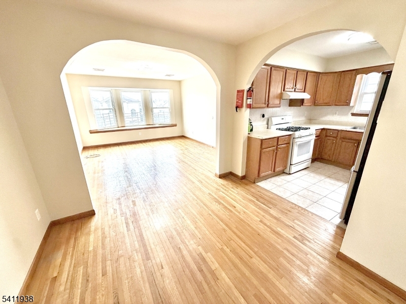 213 Palmer Street, Unit 2 Elizabeth, NJ 07202 - Photo 8 of 28 a view of kitchen and wooden floor
