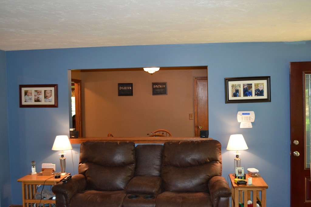 77 Old Worcester Road Charlton, MA 01507 - Photo 4 of 25 a living room with furniture and a lamp