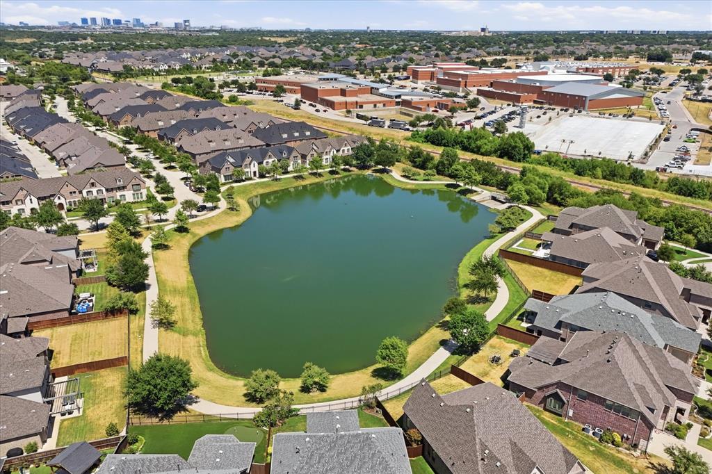 2433 Mare Road Carrollton, TX 75010 - Photo 33 of 37 Community featuring a central pond, surrounding walking path, and varied residential architecture